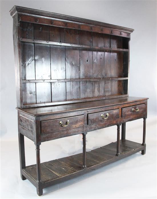 A George III oak dresser, W.6ft 4in. D.1ft 6in. H.6ft 10in.